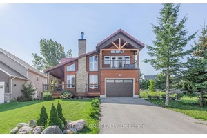 Step into this bright, custom designed home where soaring vaulted ceilings and an open layout create an inviting sense of space.