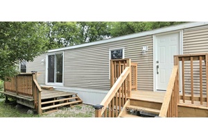 This unit is fully renovated, move in ready and on a large desirable corner lot !