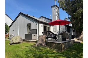 Private, one level living awaits you in this end unit bungalow in Living Waters Cranberry.