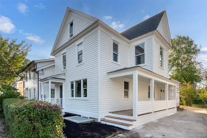 View of property exterior with roof with shingles