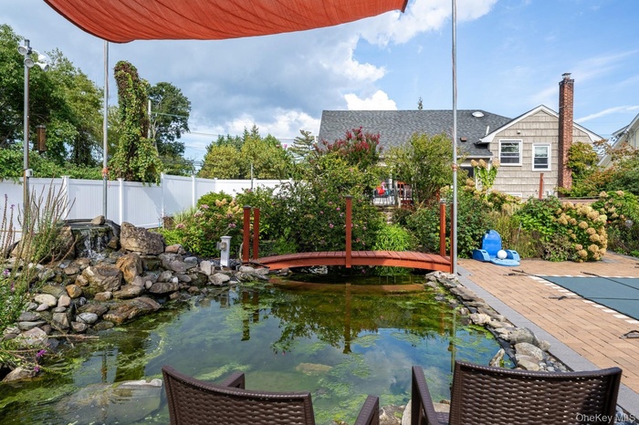 Fabulous rock garden with waterfall and wooden bridge