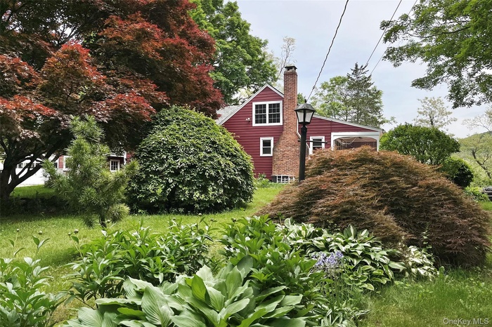 View of side of property featuring a chimney
