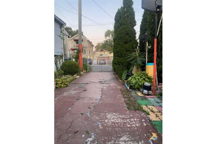 View of concrete surface with a gate and a gated entry