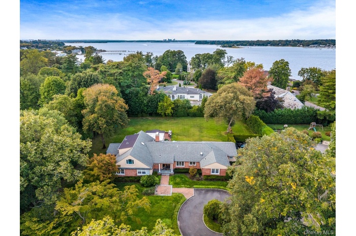 Aerial view of a large body of water and a tree filled landscape