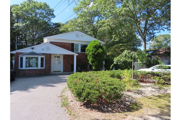 View of front of property with brick siding