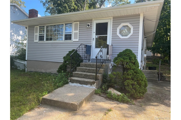 View of front of property with a chimney