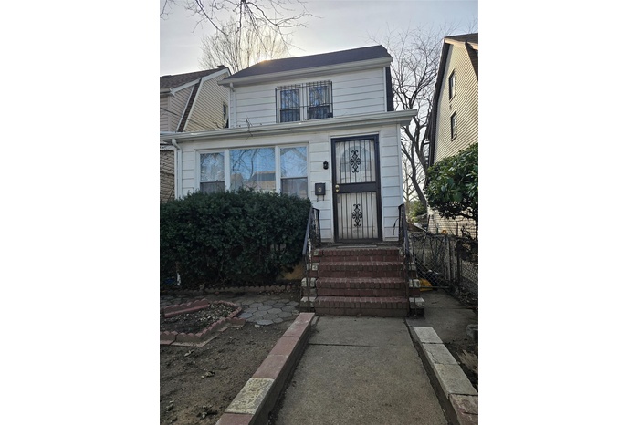 View of front of property with fence and entry steps