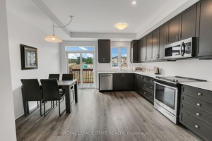 PRIVATE BACKYARD AND NO CONDO FEES Welcome to this beautifully updated 3 bedroom, three storey freehold townhome, ideally situated in a quiet, family friendly neighbourhood in Beamsville.