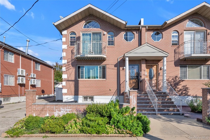 View of front of property featuring brick siding