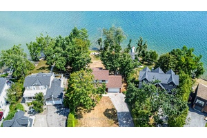 104 FEET OF IDYLLIC LAKE SIMCOE SHORELINE, WHERE SUNRISE SERENITY MEETS TIMELESS ELEGANCE !