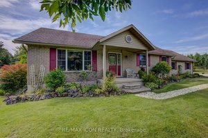 Welcome to this beautifully landscaped 3 bedroom, 2 bath country bungalow on over 2 acres with sweeping country views.