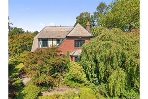 Welcome to 66 Rossmore Avenue a handsome English Tudor that blends architectural charm with modern comfort.