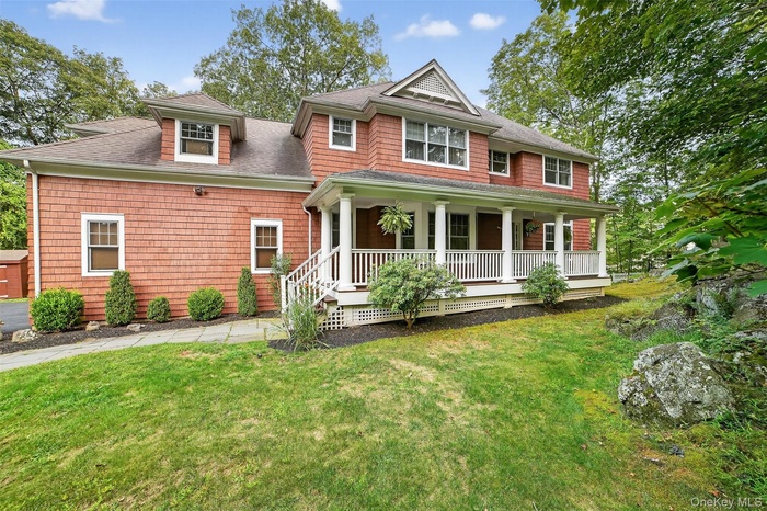 Magnificent Front Porch Colonial privately situated on lush private property