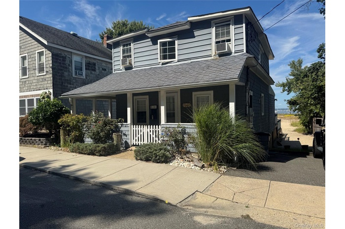 View of front of property with a porch