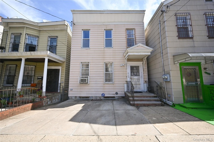 Traditional-style house featuring a balcony