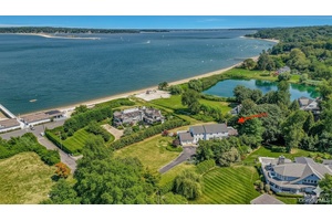 Discover a rare waterfront opportunity in the prestigious Bay Crest area of Huntington Bay.