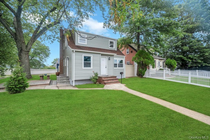 View of front of property with a chimney