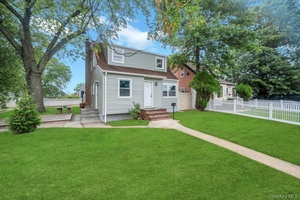 Welcome to 322 Baldwin Road located in Uniondale School District, a spacious and updated duplex offering both comfort and versatility.