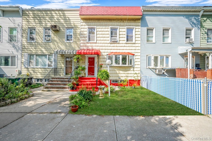 View of front of property with a front yard