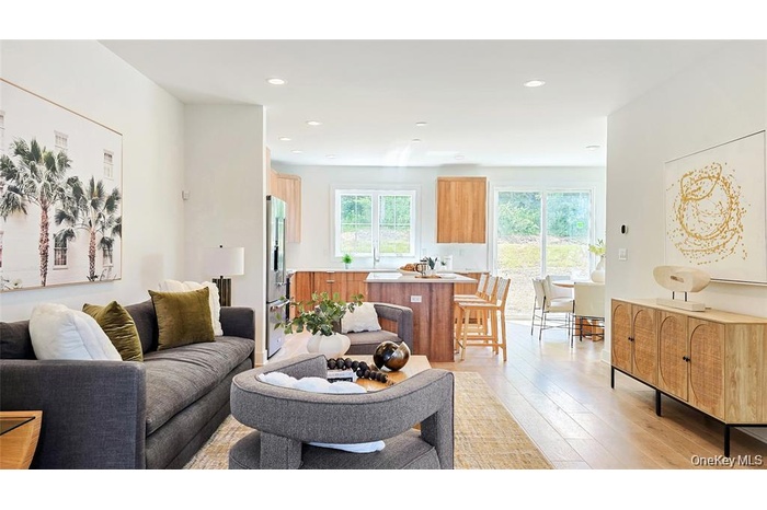 Living room with recessed lighting and light wood-style floors