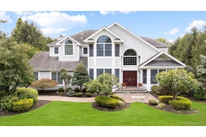 This majestic Post Modern Colonial masterpiece is located in the private, gated Dix Hills Farms community within the renowned Half Hollow Hills School District.