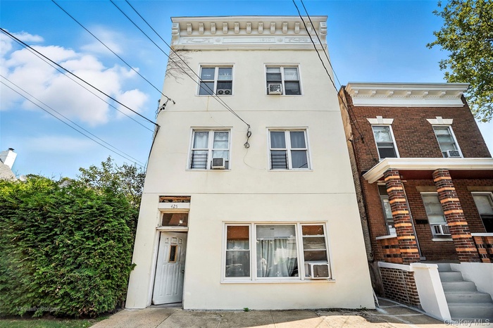 View of front of property with stucco siding and brick siding