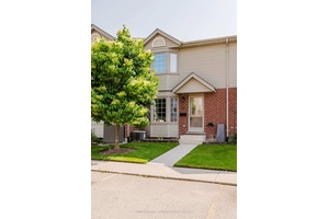 Welcome to this charming low maintenance townhouse condo, perfectly nestled in a quiet neighborhood.