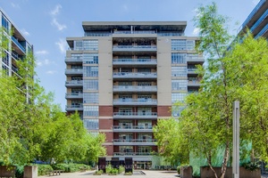 Spacious 1 Den with soaring 10 ceilings, modern finishes, and NW courtyard views.