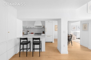 Introducing a rare opportunity to own a remarkable two bedroom, two bathroom duplex home with a home office den and two living spaces at 77 Bleecker Street, Unit 123E.