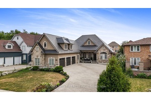 Welcome to this exceptional custom built stone and stucco bungaloft, perfectly situated on a rare 60 x 200 ft fully fenced lot.