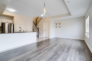 Well maintained 2 Bed, 3 Bath End Unit Stacked Townhome comes with granite counters, custom cabinets, engineered floors, and high end S S appliances.