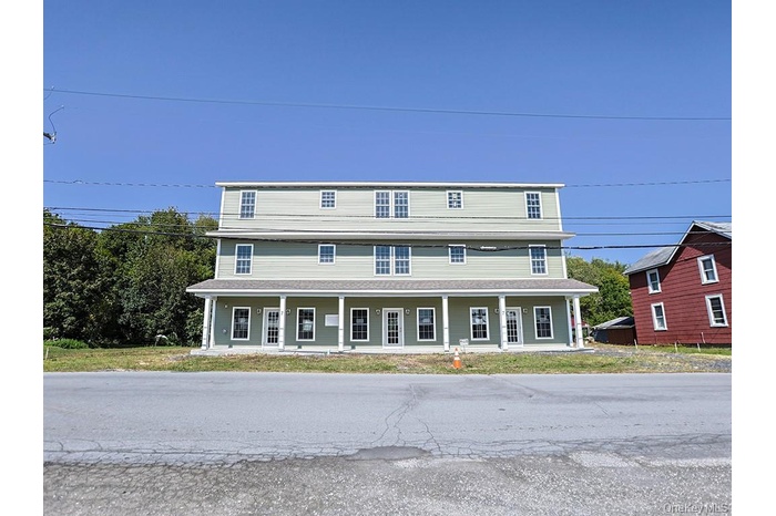 View of front of house with covered porch