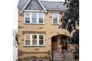 Presenting 77 42, a semi detached two family brick home ideally situated in Glendale.