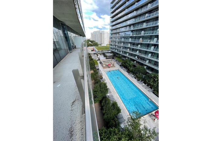Community pool featuring a patio