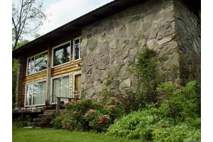 Welcome to a truly special property designed as a replica of a classic chalet in the ski region of St.