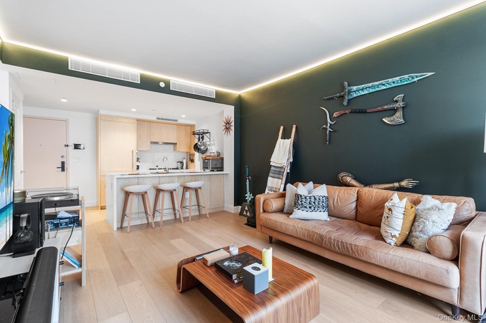 Living room featuring light hardwood / wood-style flooring and sink