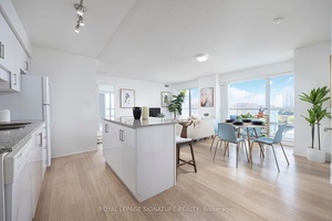 Stunning southwest facing corner unit at the sought after Legacy Condos !