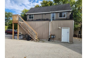 This great little winterized apartment is located on the upper floor of a 2 storey building on the waterfront at Balm Beach in Tiny Township.