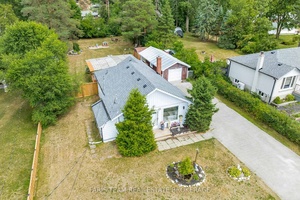 Top 5 Reasons You Will Love This Home 1 Nestled on a spacious property, this well kept bungalow boasts a quiet escape surrounded by mature greenery, ideal for those seeking ...