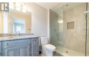 Welcome to Magnificent Monarch Woods, a stunning corner unit townhome in the highly sought after Doon South community, backing onto lush greenspace and filled with natural light.