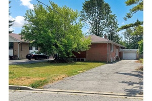 Spacious main floor bungalow unit featuring 3 1 bedrooms and one full bath, ideal for families or students looking for comfortable living.