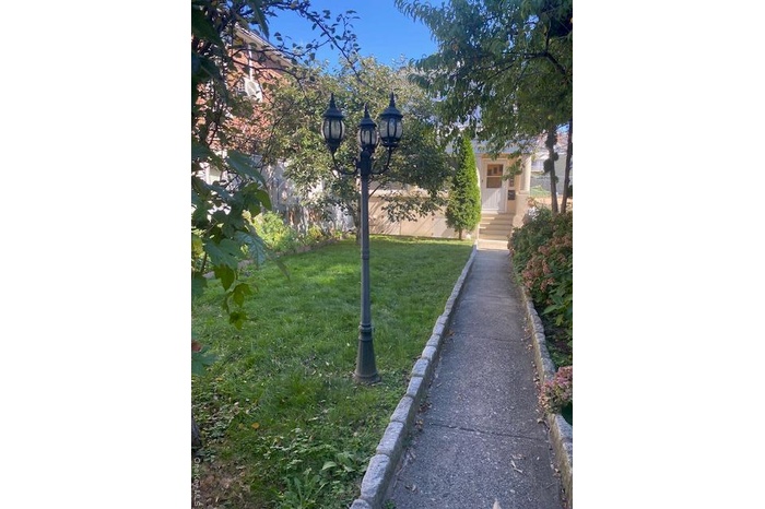 View of home's community featuring a yard