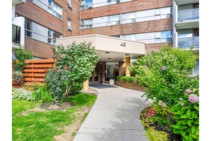 Renovated Main Floor Residence with Private Terrace in a Tranquil, Park Like Setting !