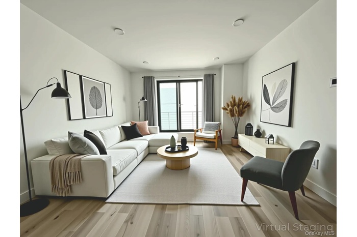 Living room featuring light wood-style flooring
