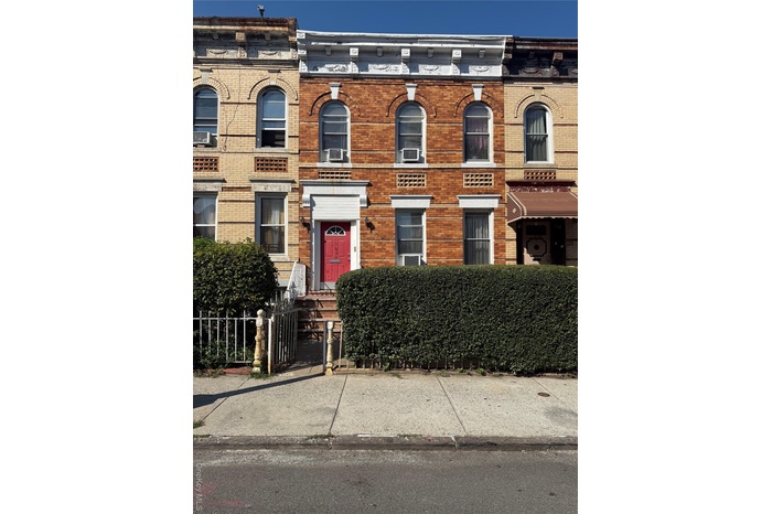 Italianate-style house with brick siding