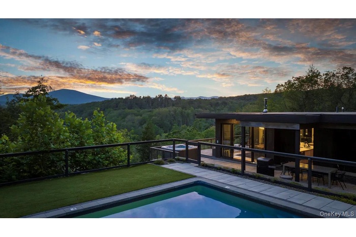 Pool at dusk with mountain view