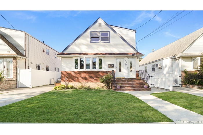 View of front of property featuring brick siding