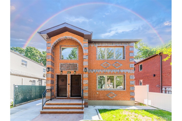 View of front of property with brick siding