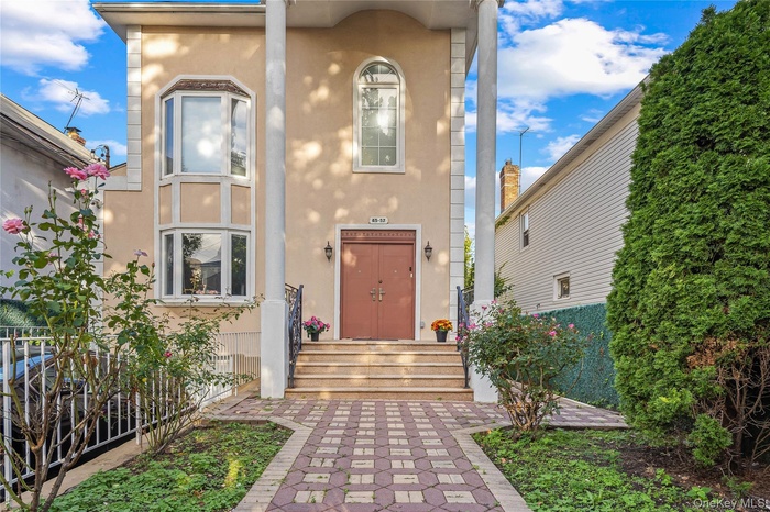 Property entrance featuring stucco siding