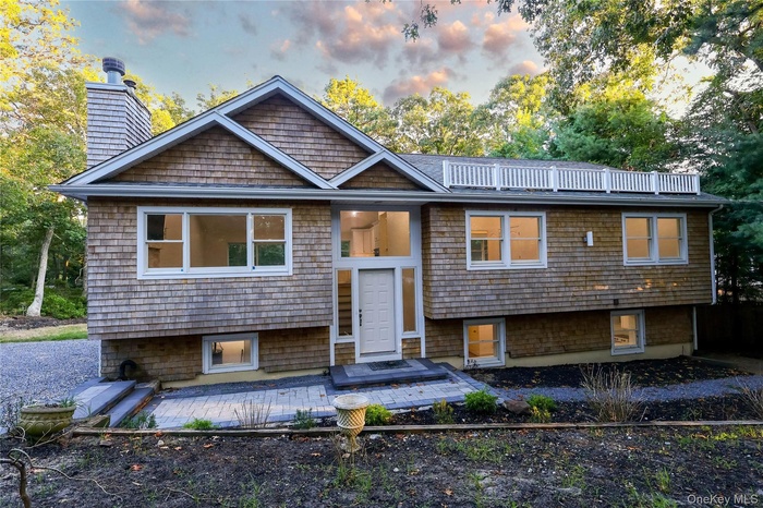 Split foyer home with a chimney